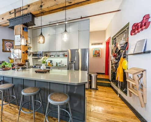 Chicago loft kitchen with timber beam - buy this loft!
