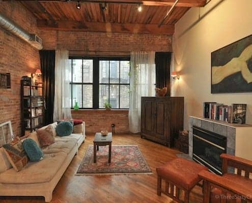 Classic brick and timber Chicago loft living area 495x400