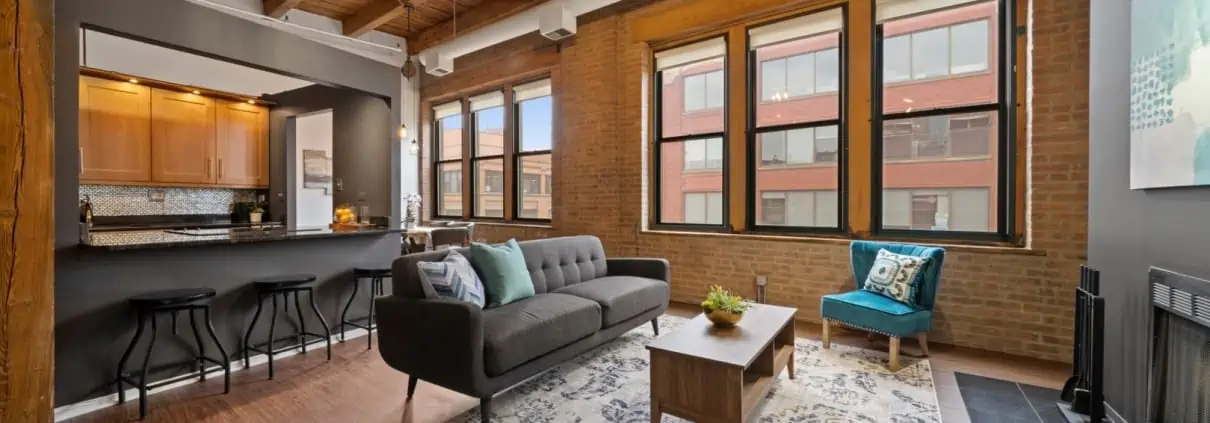 Living area in Chicago West Loop brick and timber loft rental